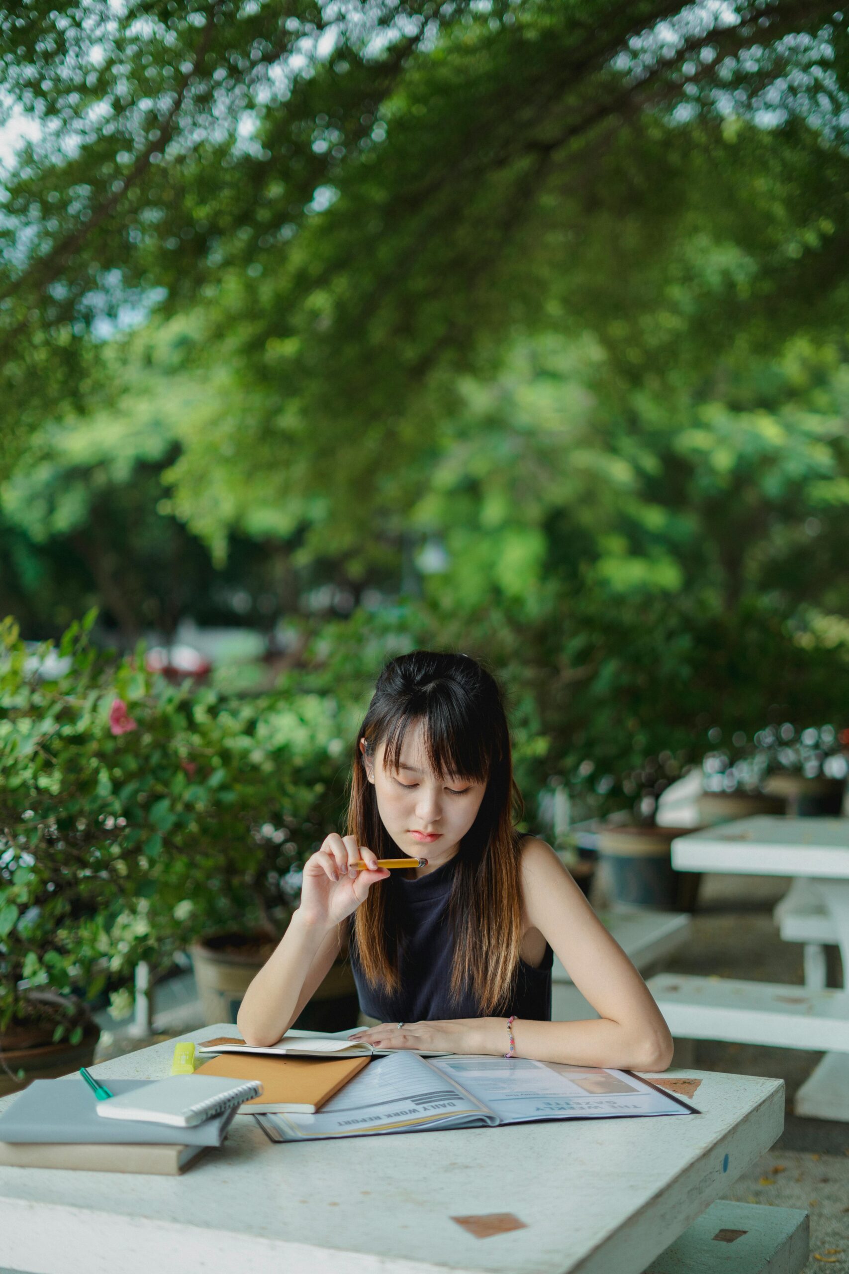 asian girl study on bench